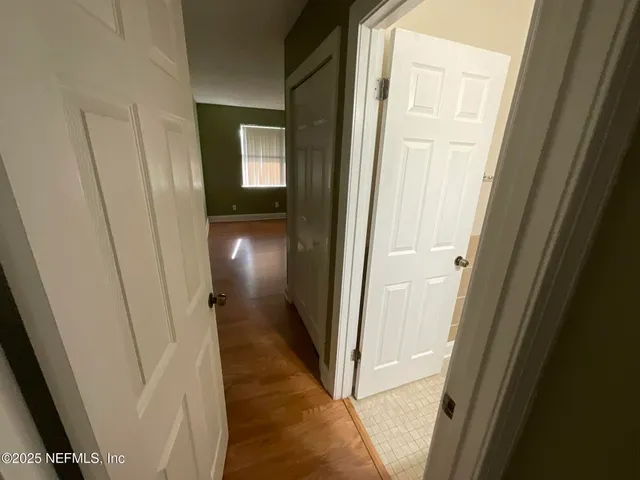 an empty room with wooden floor