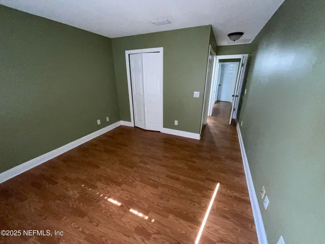 a bathroom with a glass door shower