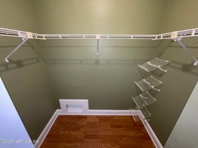 a view of a room with racks on the wall