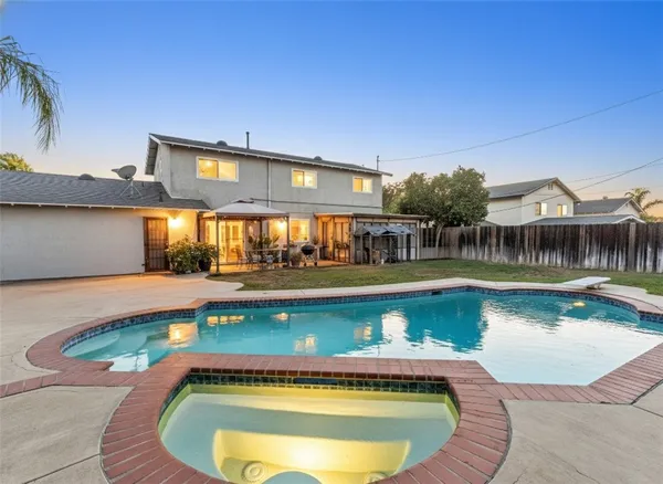 a view of a swimming pool with a patio