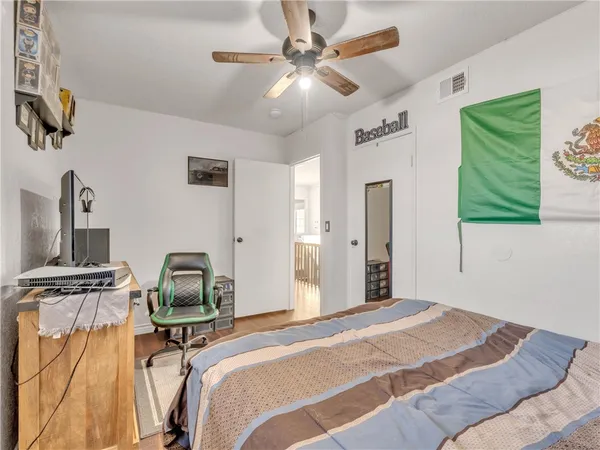 a bedroom with furniture and a window