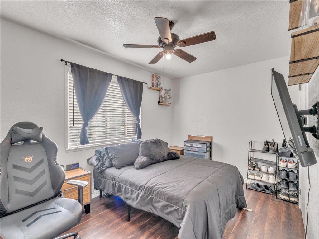 714 Appleton Road Simi Valley, CA 93065 - Photo 30 of 45 a bedroom with a bed and wooden floor