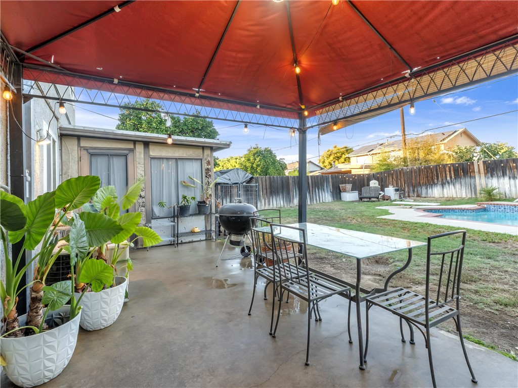 714 Appleton Road Simi Valley, CA 93065 - Photo 32 of 45 a patio with a table and chairs and a umbrella
