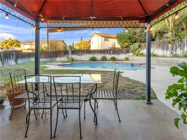 a view of swimming pool with outdoor seating