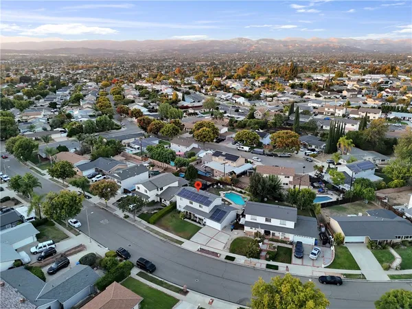 an aerial view of residential building with green space