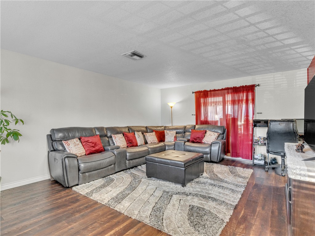 714 Appleton Road Simi Valley, CA 93065 - Photo 7 of 45 a living room with furniture and a wooden floor
