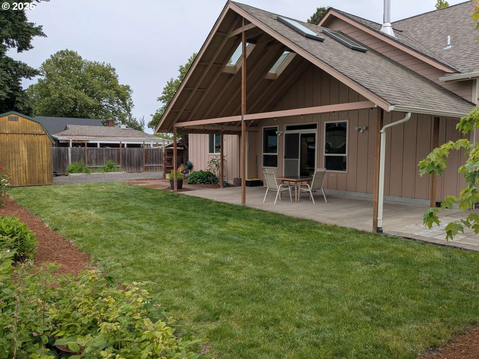 4235 Jessen Drive Eugene, OR 97402 - Photo 20 of 31 a backyard of a house with table and chairs