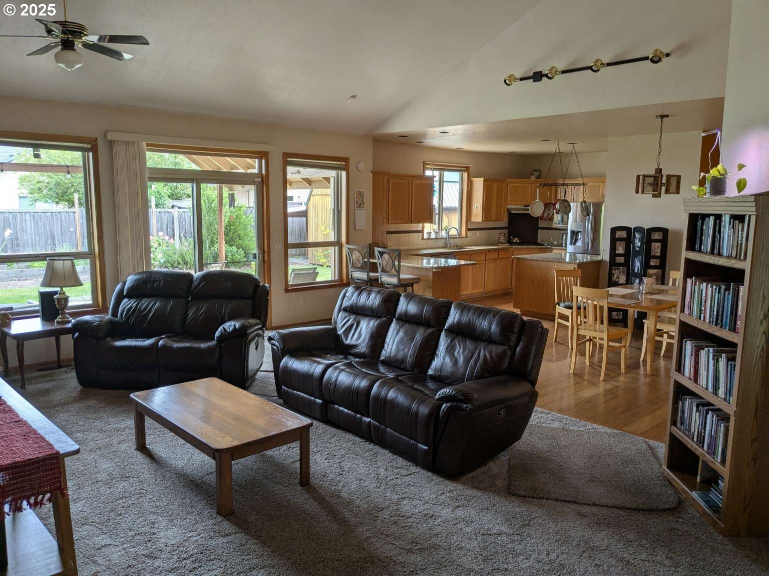 4235 Jessen Drive Eugene, OR 97402 - Photo 29 of 31 a living room with furniture and a book shelf