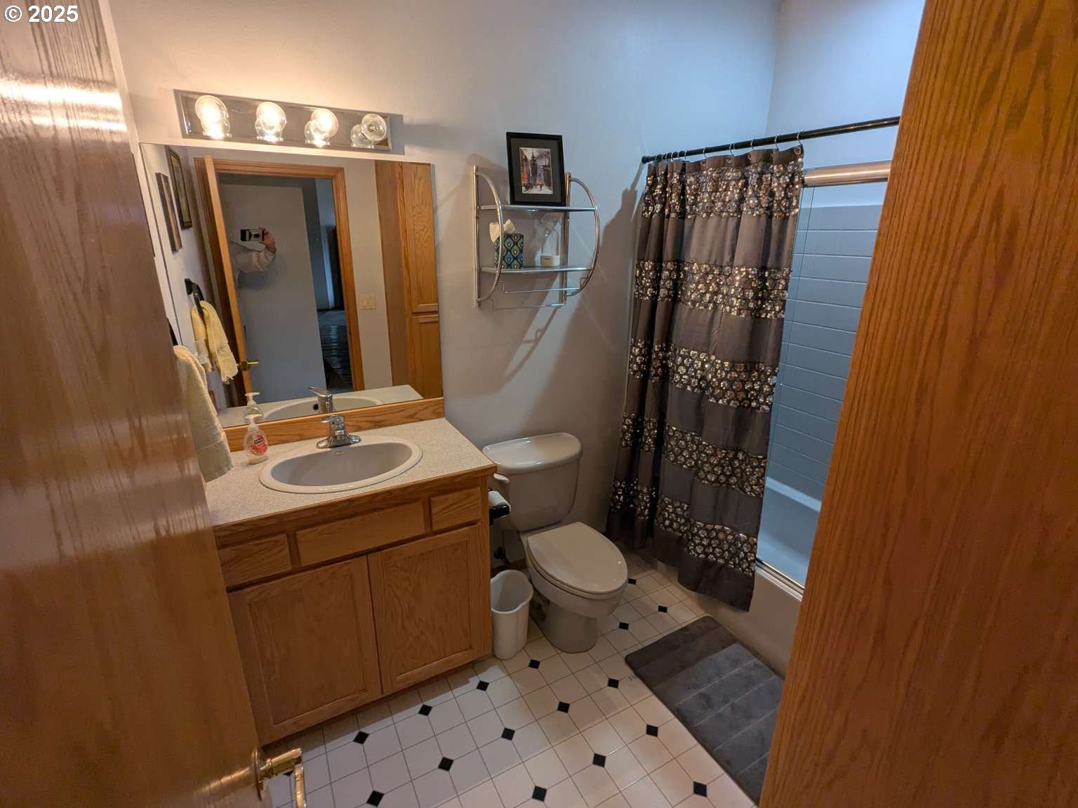 4235 Jessen Drive Eugene, OR 97402 - Photo 7 of 31 a bathroom with a sink toilet and shower