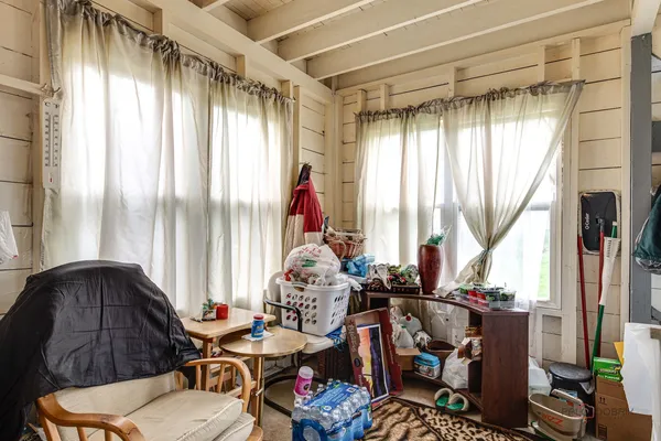 a room with furniture and a large window