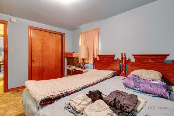 a bed room with two bed and a couch