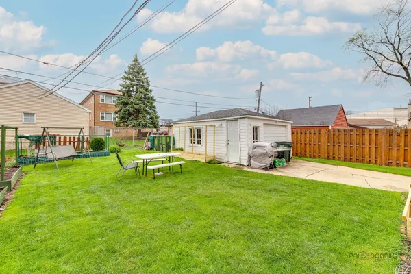 a view of a house with a yard porch and sitting area
