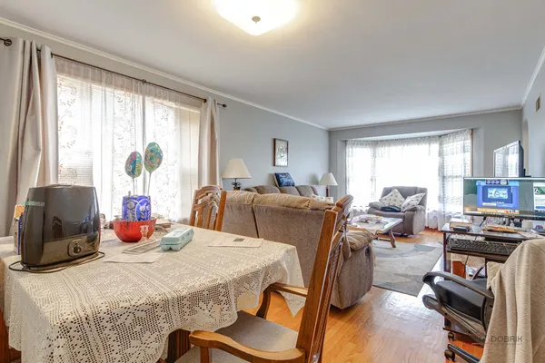 a bedroom with furniture and a large window