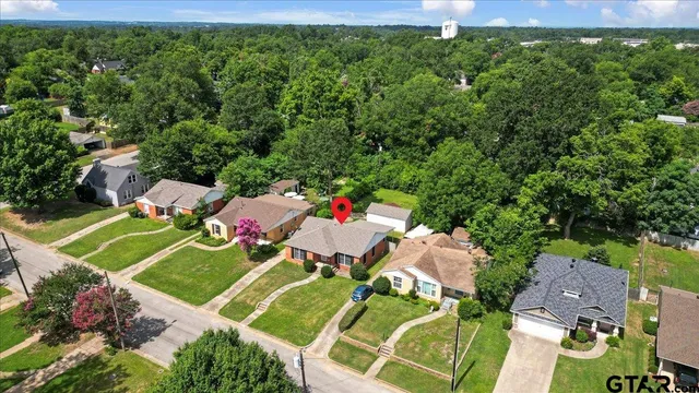 an aerial view of a house with a garden
