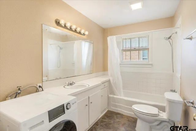 a bathroom with a double vanity sink mirror double and toilet