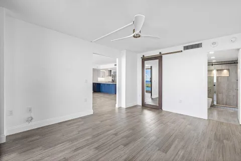 a view of livingroom with hardwood floor and a ceiling fan