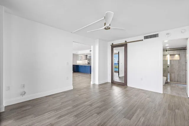 a view of livingroom with hardwood floor and a ceiling fan