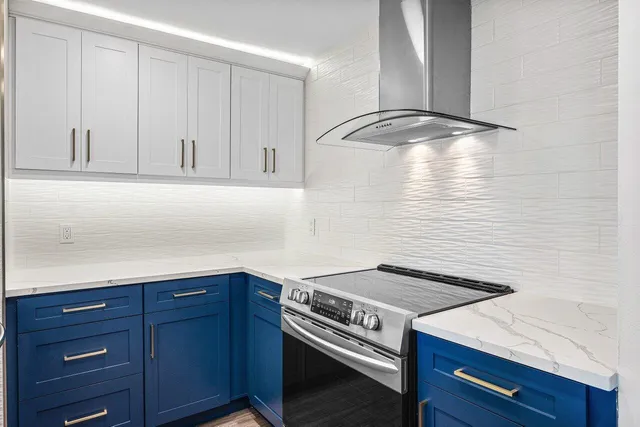 a kitchen with a cabinets and white stove