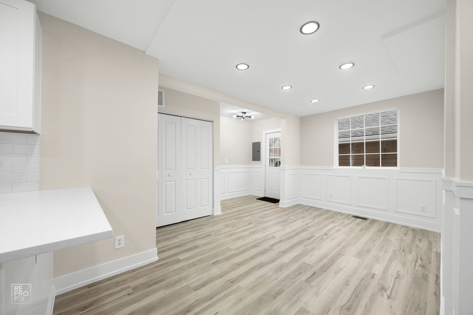 5147 Long Avenue Chicago, IL 60638 - Photo 7 of 17 a view of an empty room with wooden floor and windows