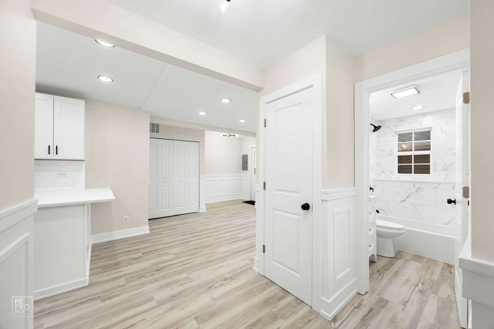 5147 Long Avenue Chicago, IL 60638 - Photo 8 of 17 a large white kitchen with white cabinets