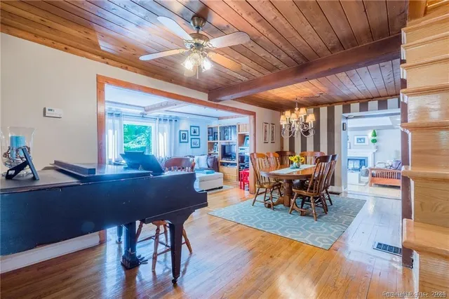 a view of a dining room with furniture window and wooden floor