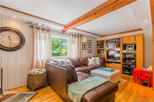 a living room with furniture and a window