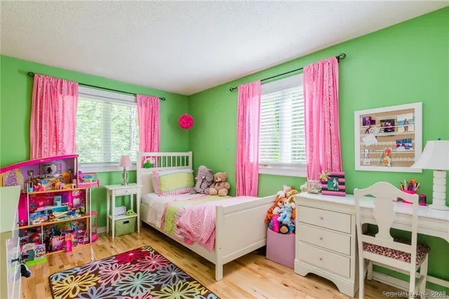 a bedroom with a bed window and bed