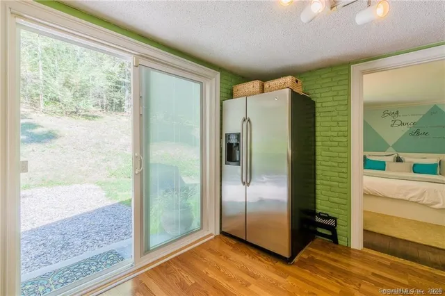 a kitchen with a refrigerator and a sink