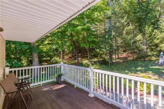 a view of a two chairs in the balcony