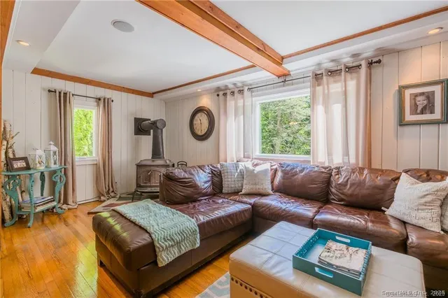 a living room with furniture and a window