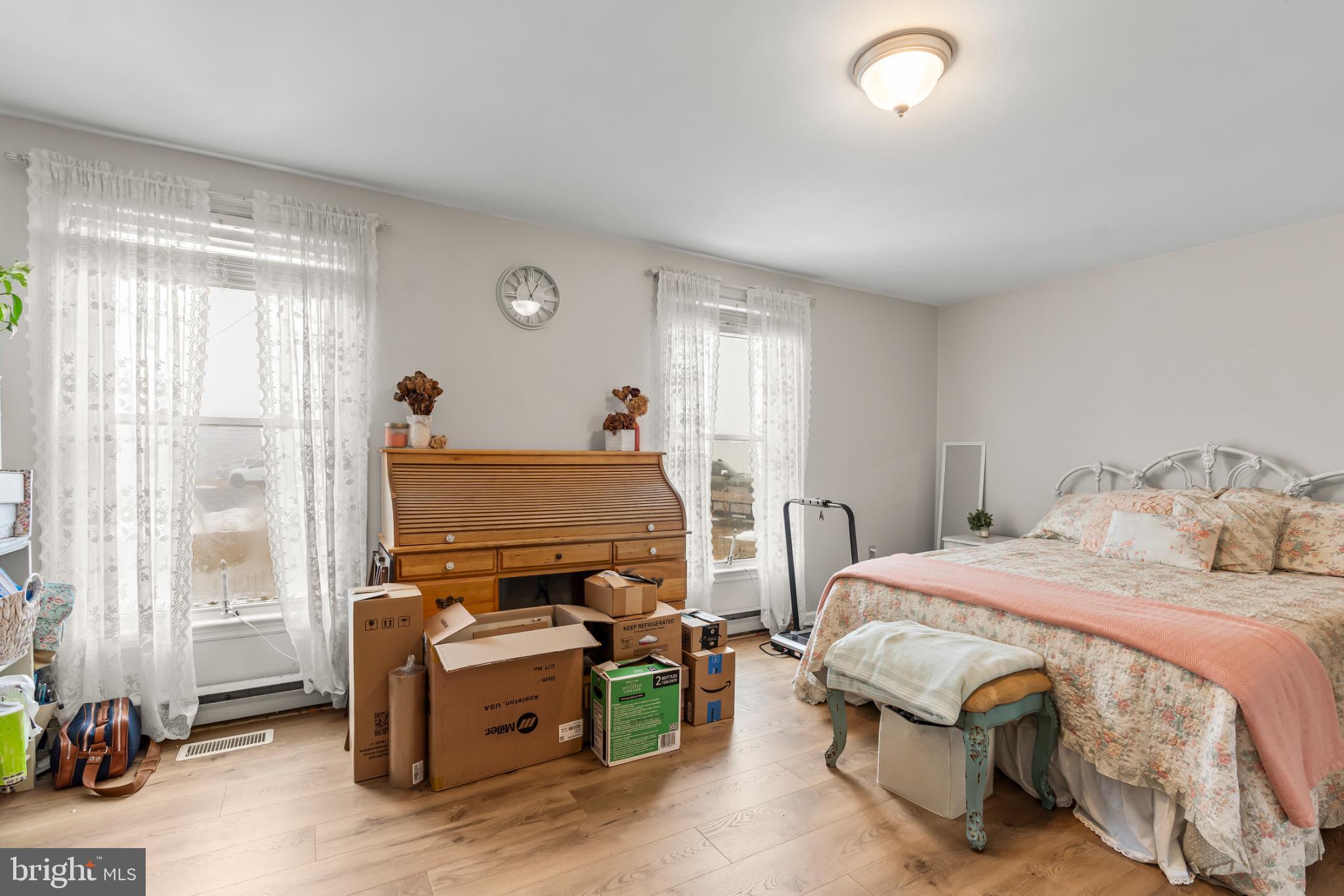 94 Tulip Court Falling Waters, WV 25419 - Photo 15 of 32 a bedroom with a bed and a window