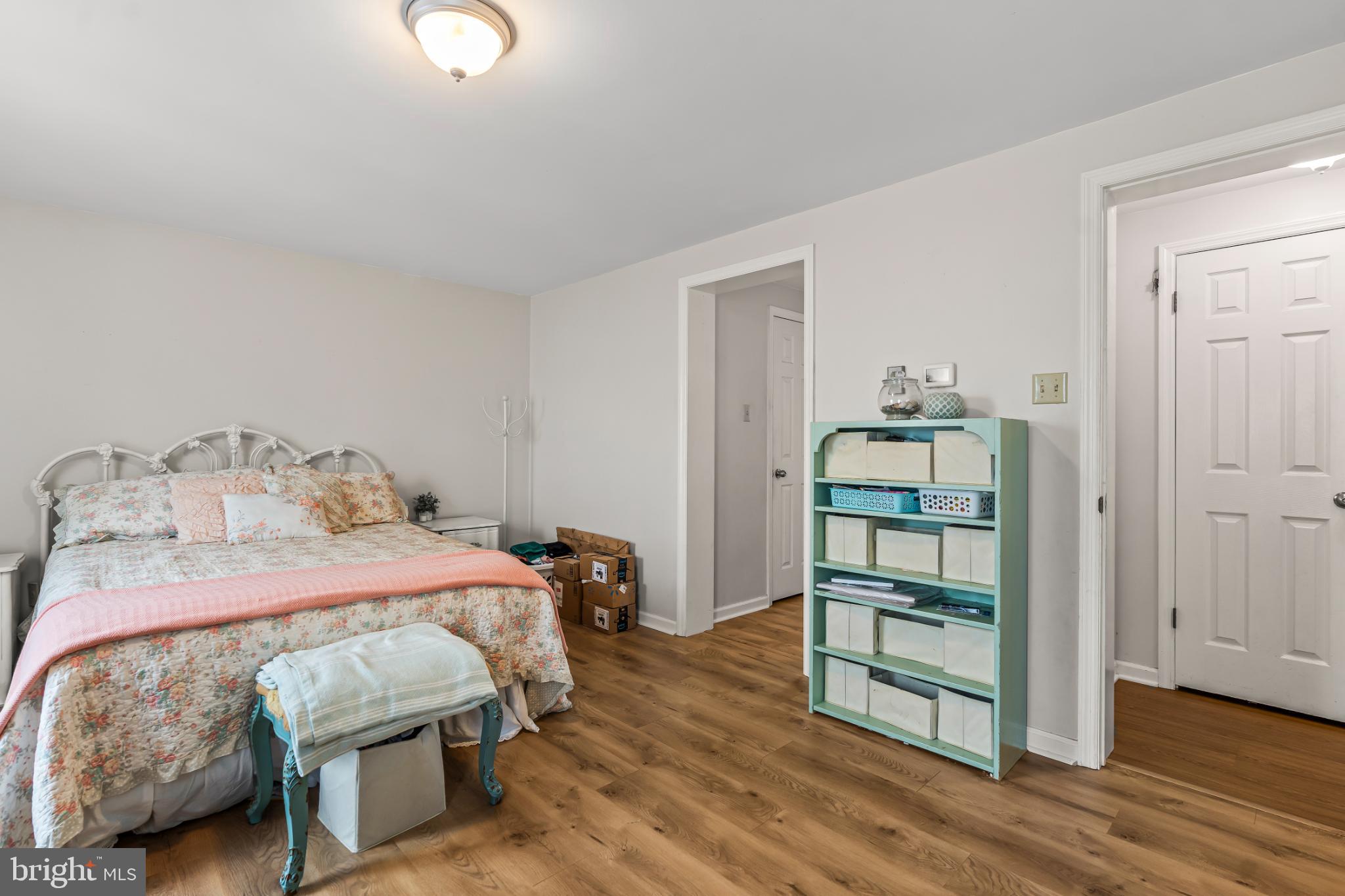 94 Tulip Court Falling Waters, WV 25419 - Photo 16 of 32 a bedroom with a bed and wooden floor