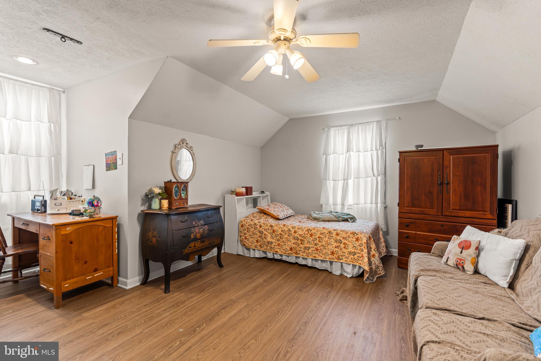 94 Tulip Court Falling Waters, WV 25419 - Photo 20 of 32 a bedroom with bed and window