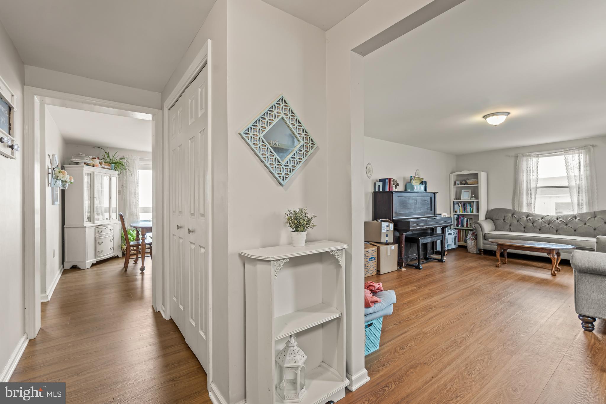 94 Tulip Court Falling Waters, WV 25419 - Photo 2 of 32 a living room with furniture and a wooden floor