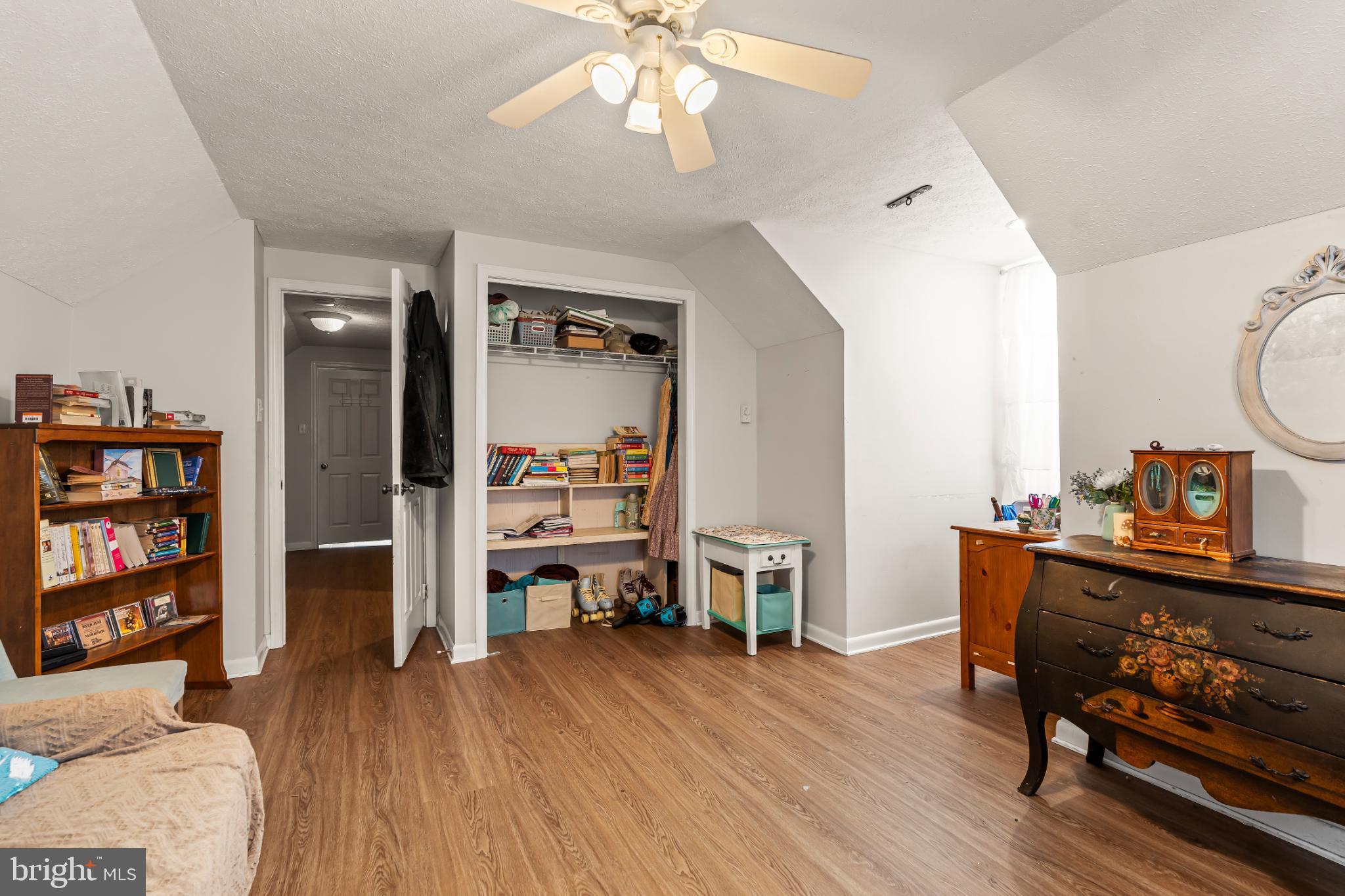 94 Tulip Court Falling Waters, WV 25419 - Photo 21 of 32 a living room with furniture and a wooden floor