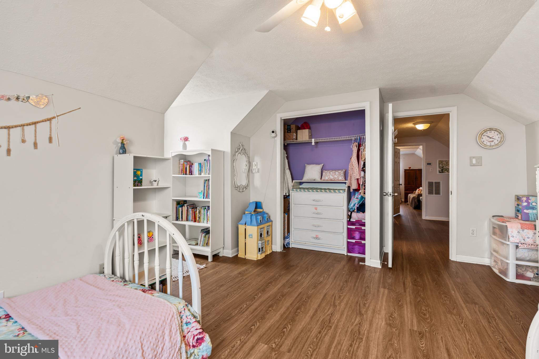 94 Tulip Court Falling Waters, WV 25419 - Photo 25 of 32 a bedroom with furniture and a wooden floor