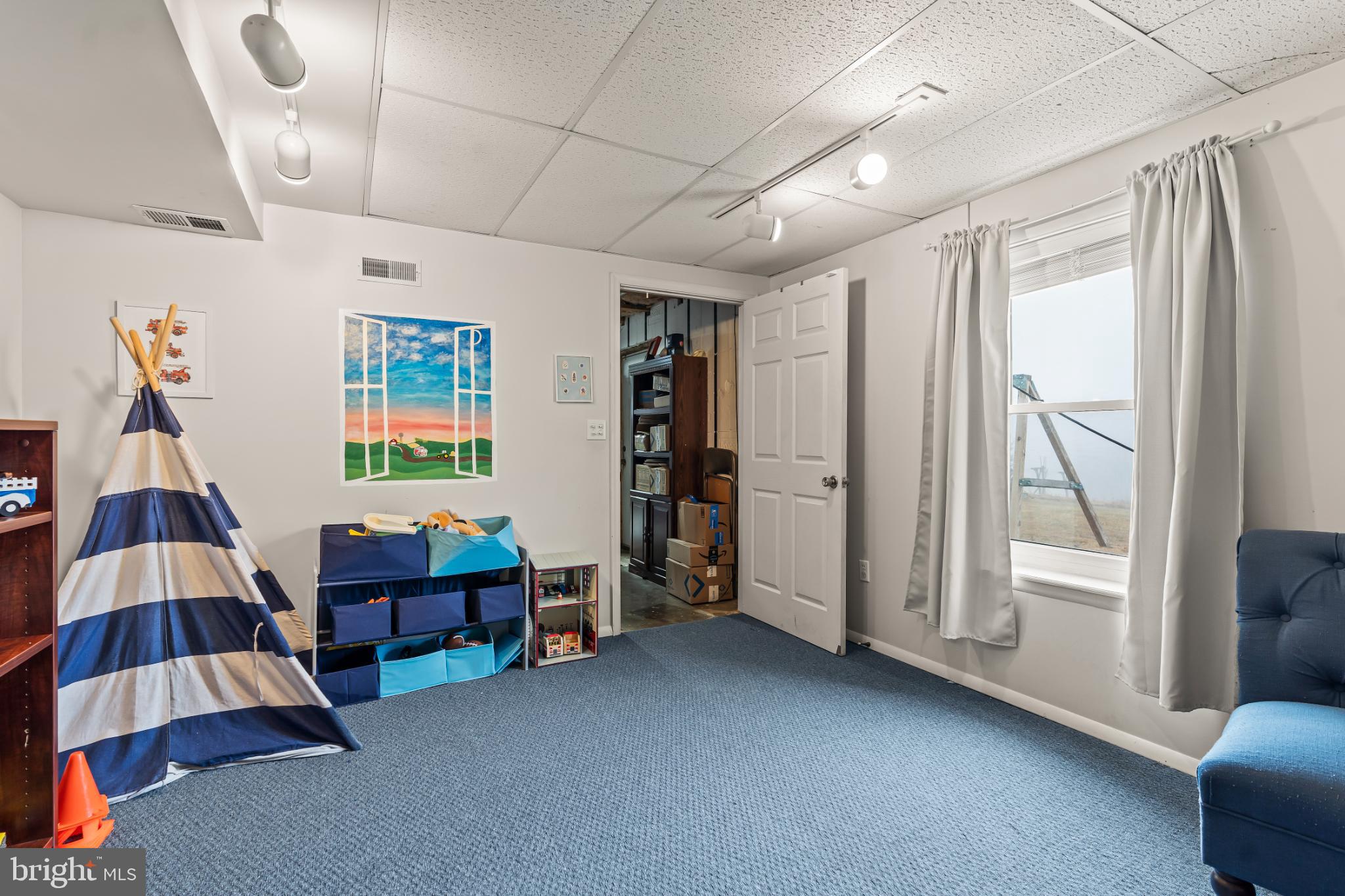 94 Tulip Court Falling Waters, WV 25419 - Photo 29 of 32 a room with furniture and a window
