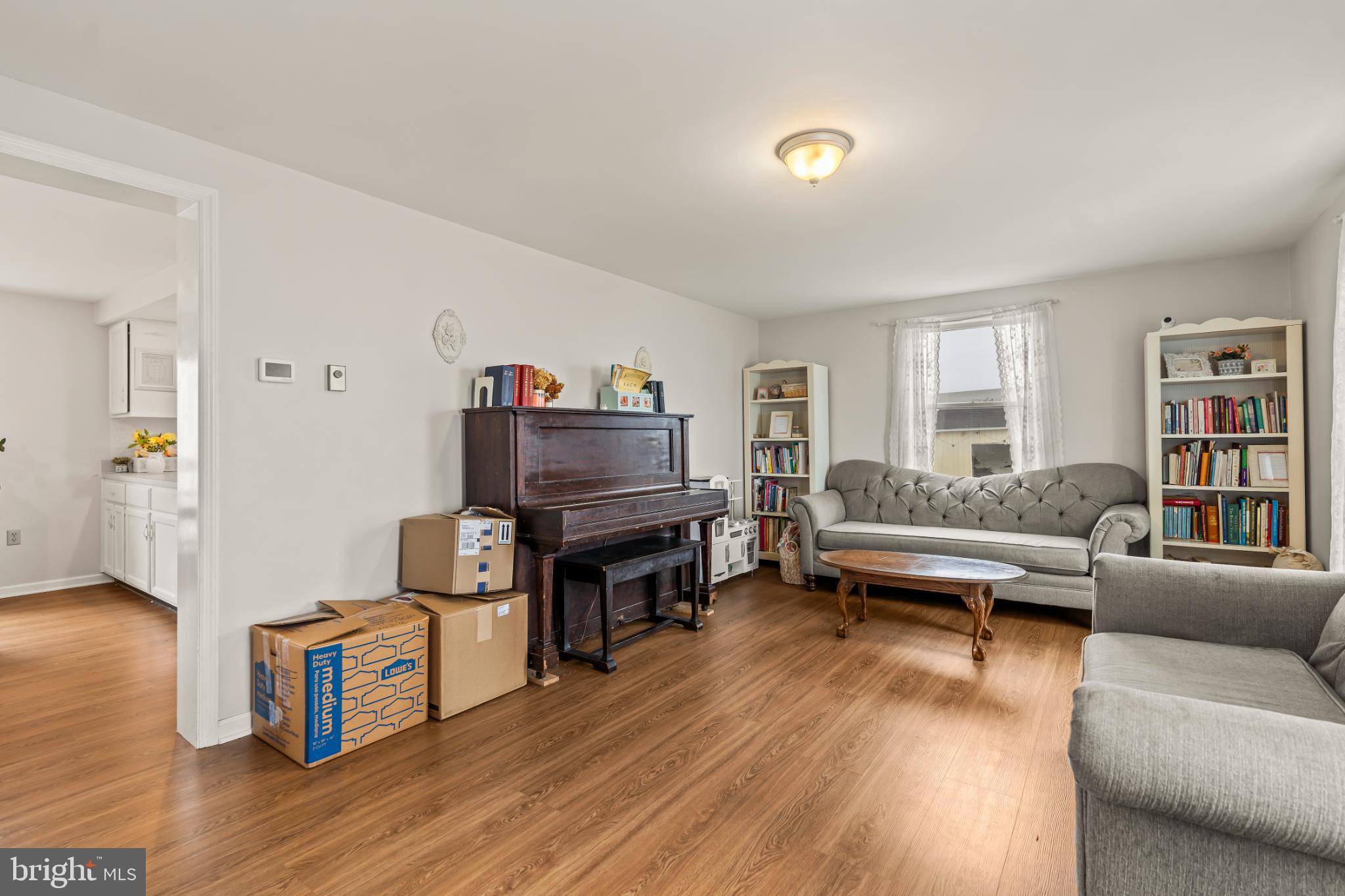94 Tulip Court Falling Waters, WV 25419 - Photo 3 of 32 a living room with furniture and a wooden floor