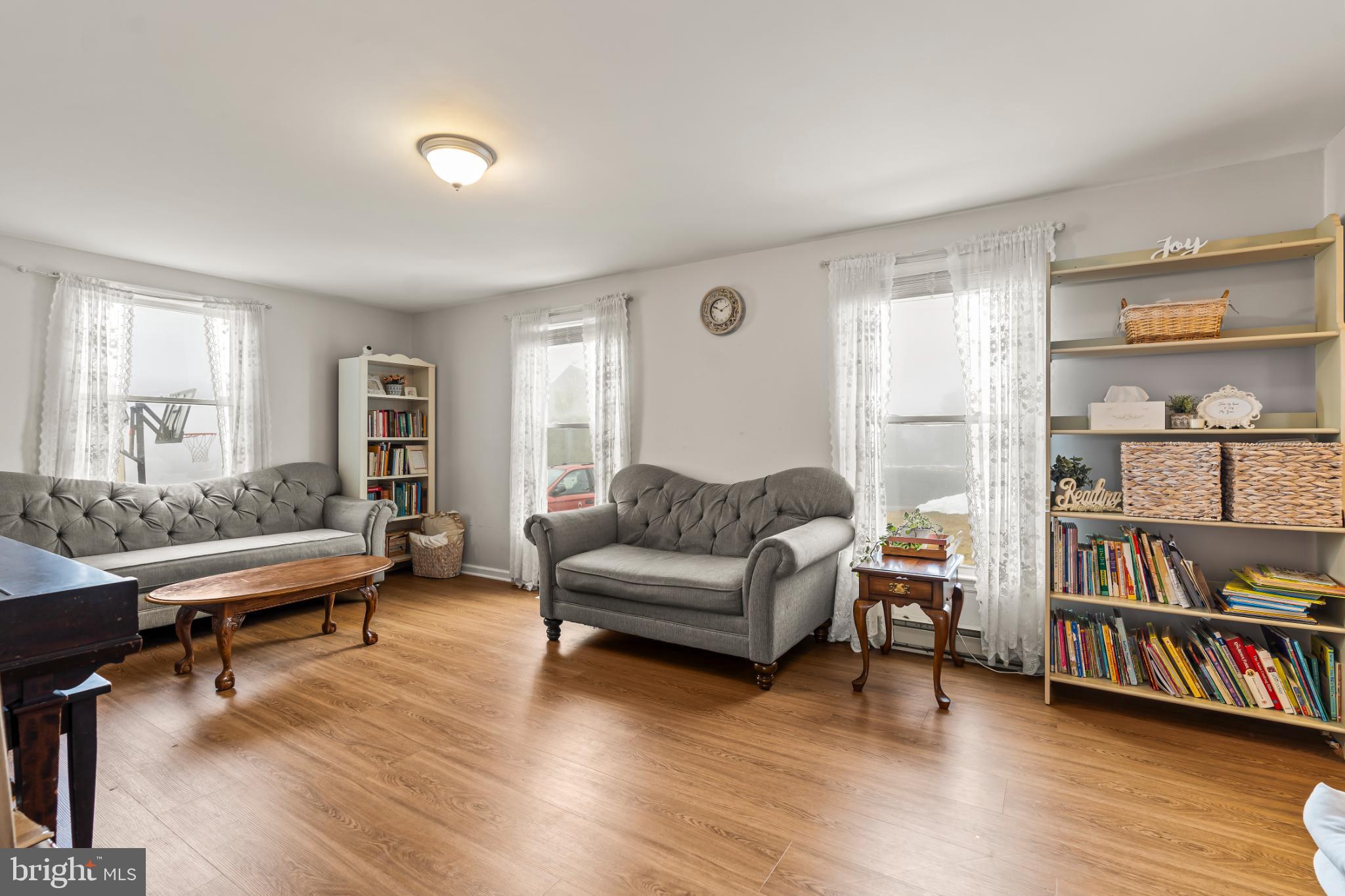 94 Tulip Court Falling Waters, WV 25419 - Photo 4 of 32 a living room with furniture and a book shelf