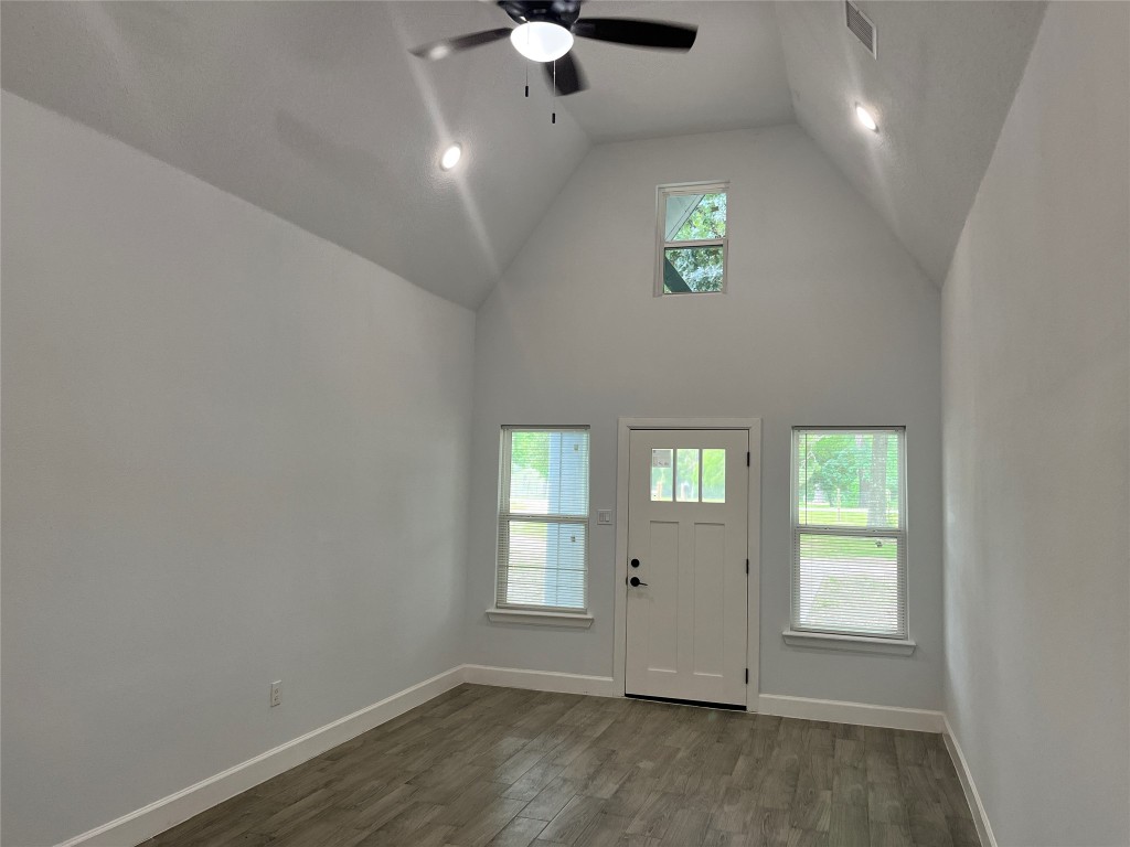 482 Rolling Livingston, TX 77351 - Photo 14 of 41 an empty room with windows and ceiling fan
