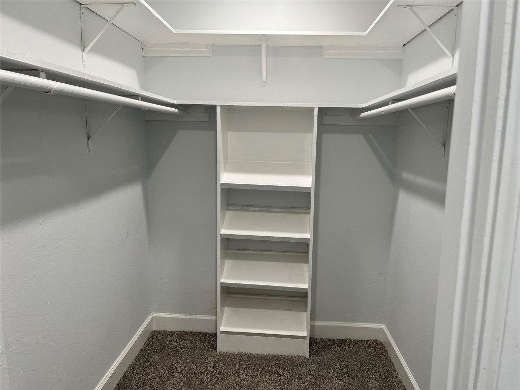 482 Rolling Livingston, TX 77351 - Photo 18 of 41 a view of walk in closet with empty racks