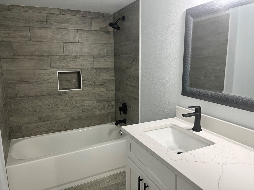 482 Rolling Livingston, TX 77351 - Photo 21 of 41 a bathroom with a sink a bathtub and a shower