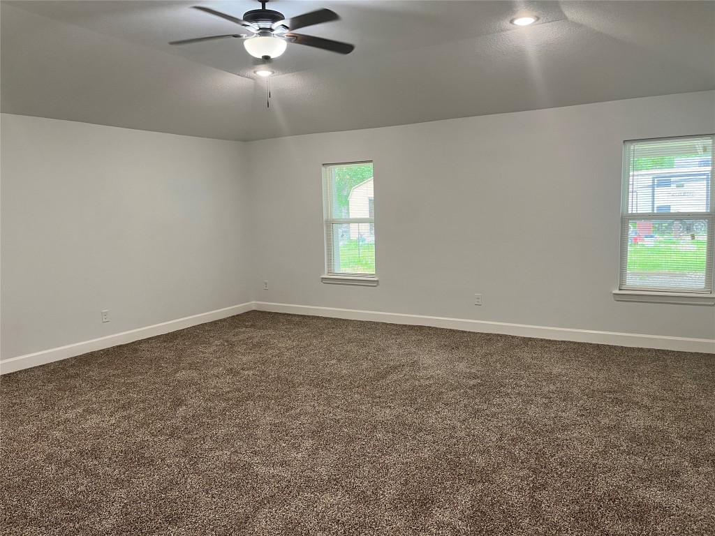 482 Rolling Livingston, TX 77351 - Photo 22 of 41 an empty room with ceiling fan and window