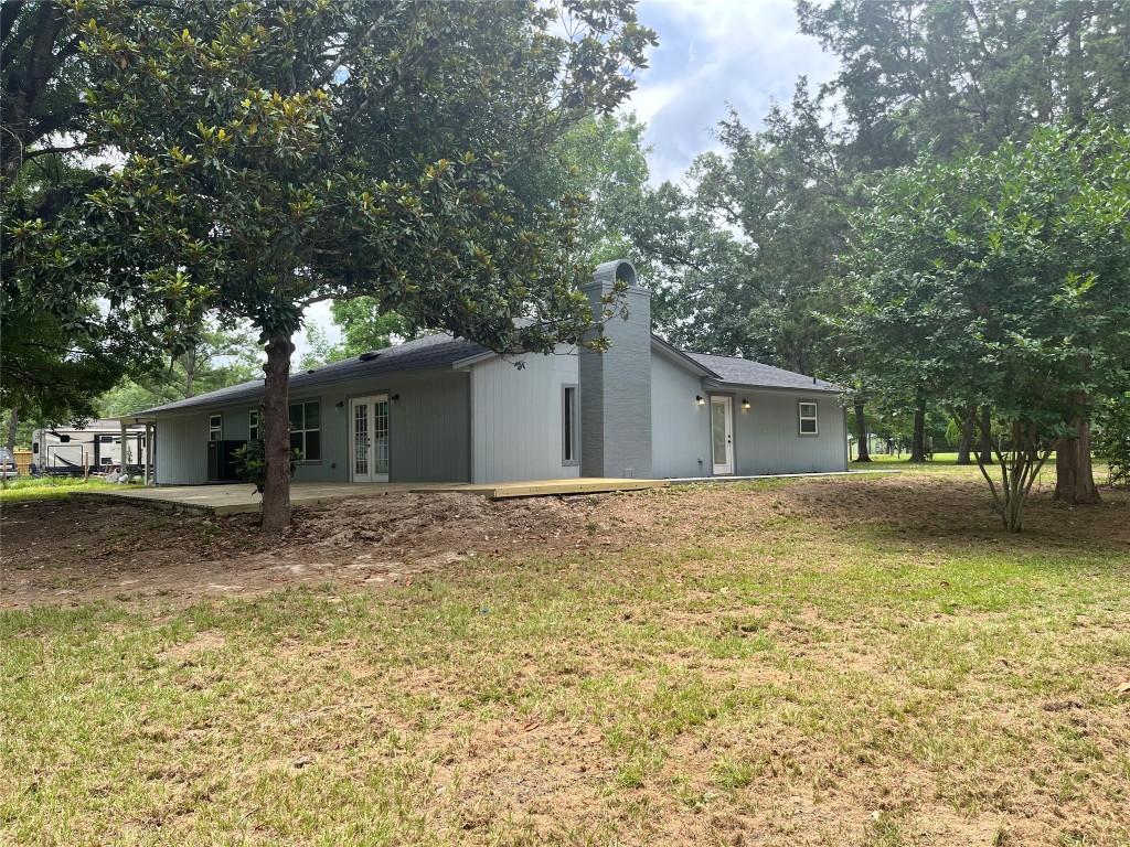482 Rolling Livingston, TX 77351 - Photo 39 of 41 a view of a house with a yard and large tree