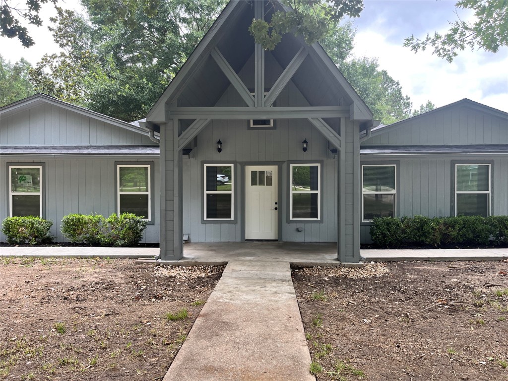 482 Rolling Livingston, TX 77351 - Photo 5 of 41 a front view of a house with a yard and potted plants