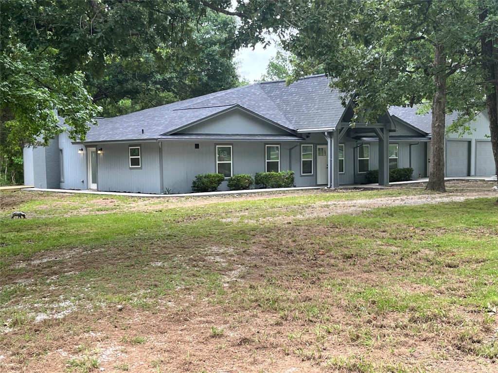 482 Rolling Livingston, TX 77351 - Photo 9 of 41 a front view of a house with a garden