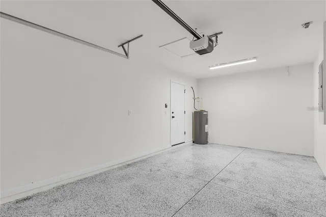 a view of a livingroom with a ceiling fan and window