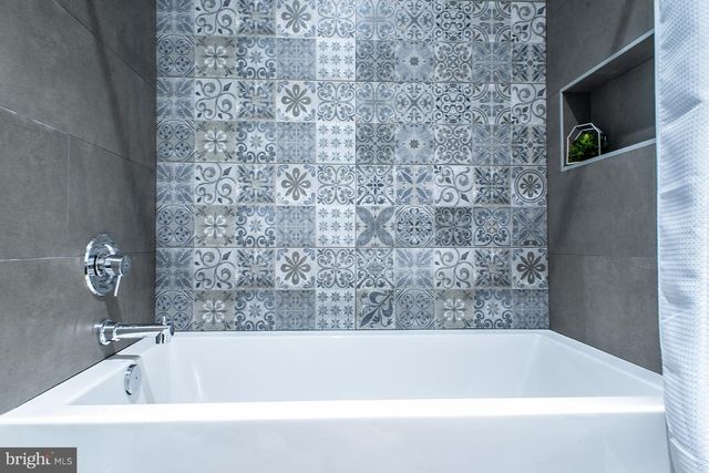 a bathroom with a bathtub