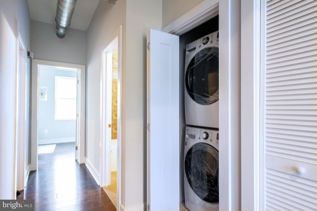 a view of a hallway with washer and dryer