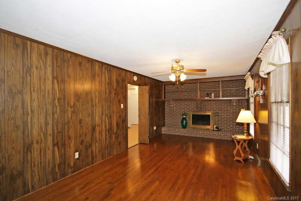 2 Old Farm Road Salisbury, NC 28147 - Photo 11 of 24 a view of a livingroom with wooden floor and staircase